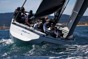 Kiwi Magic (KZ-7): The revolutionary "Plastic Fantastic" in full flight. The 12mR yacht Kiwi Magic (KZ-7) heeling in the wind, showing the crew at work during the Toulon Provence Regatta 2026.